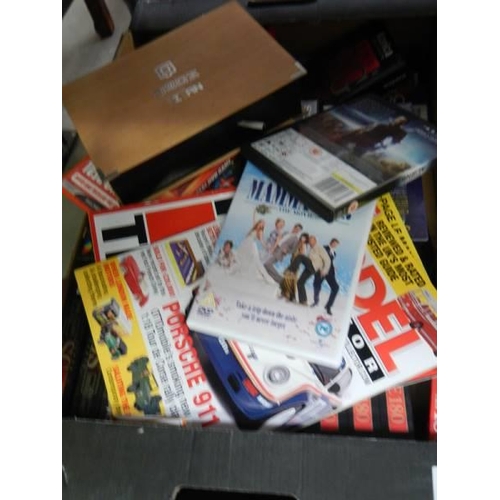 1544 - Two boxes of assorted DVD's, magazines etc.,