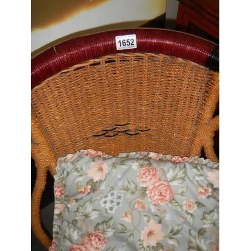 1652 - An old wicker bedroom chair with tow cushions, COLLECT ONLY.