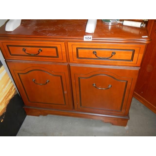 1654 - A two door, two drawer mahogany cabinet, COLLECT ONLY.