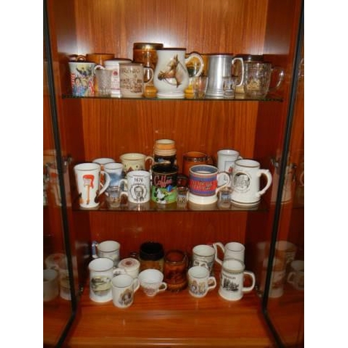 1676 - Three shelves of tankards and mugs including advertising, COLLECT ONLY.