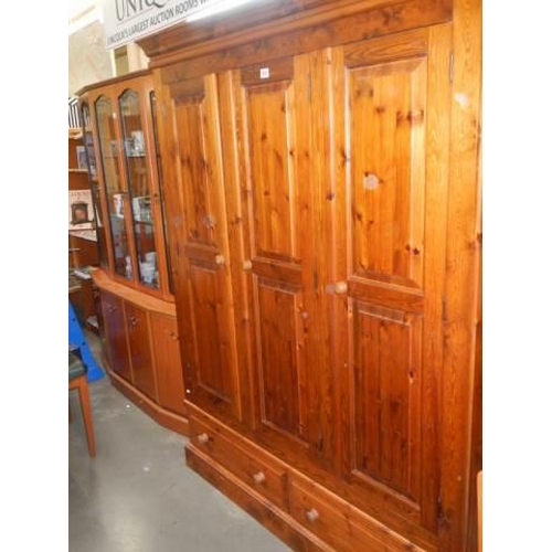 1683 - A good quality three door pine wardrobe, COLLECT ONLY.