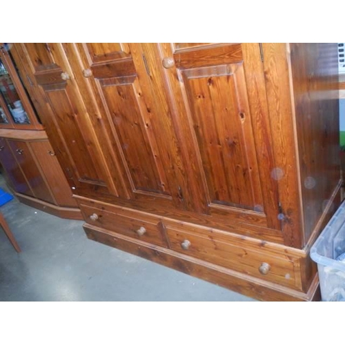 1683 - A good quality three door pine wardrobe, COLLECT ONLY.