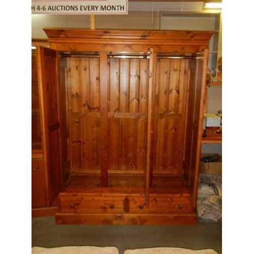 1683 - A good quality three door pine wardrobe, COLLECT ONLY.