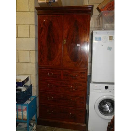 1717 - A good quality two door cupboard on drawer base. COLLECT ONLY.