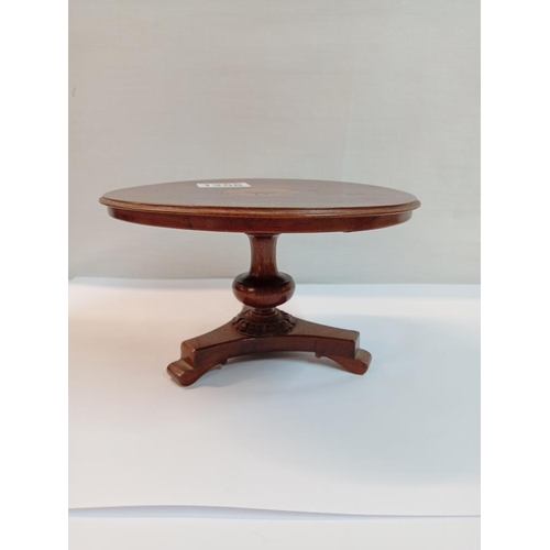 1258 - A small inlaid pedestal table, trademan's sample dolls house. Diameter 19.5cm, Height 11cm