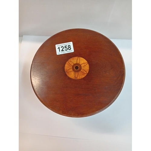 1258 - A small inlaid pedestal table, trademan's sample dolls house. Diameter 19.5cm, Height 11cm