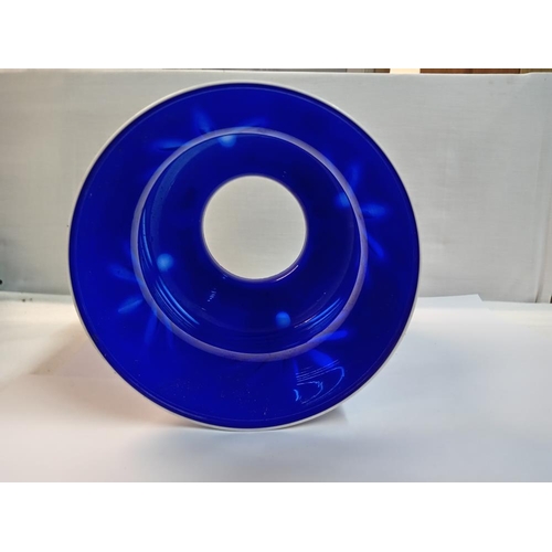 1295 - A large overlaid blue glass lampshade. Height 23cm, Diameter of base 11.5cm, diameter at top 19cm