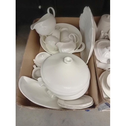 1243 - 2 good boxes of white dinnerware including 2 tureens etc.