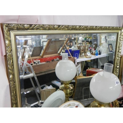 692 - A gilt framed bevel edged mirror. COLLECT ONLY.