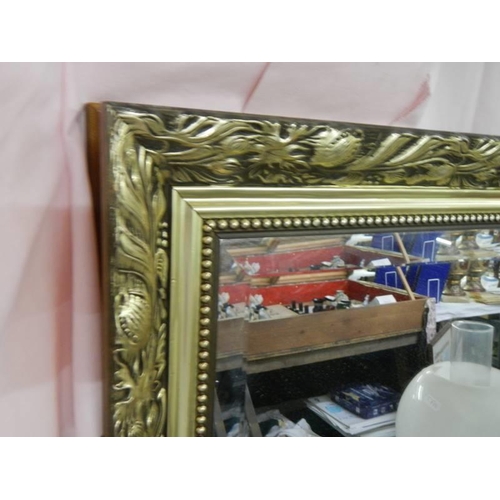 692 - A gilt framed bevel edged mirror. COLLECT ONLY.