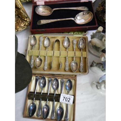 702 - Three cased sets of vintage spoons.