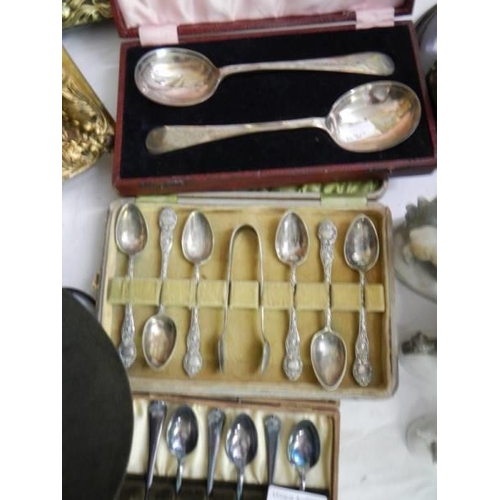 702 - Three cased sets of vintage spoons.