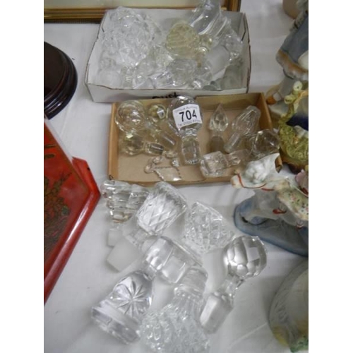 704 - A large quantity of glass decanter stoppers.