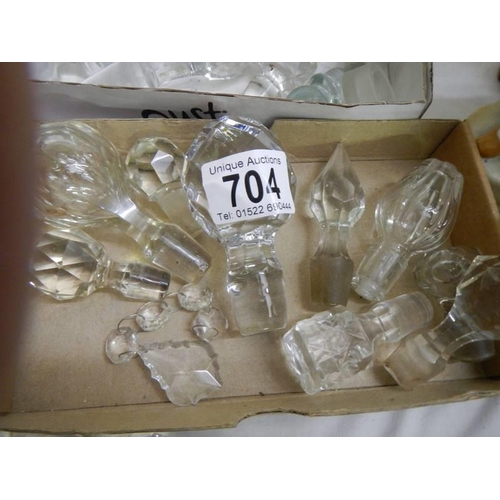 704 - A large quantity of glass decanter stoppers.