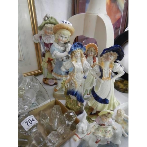 705 - A good lot of continental porcelain figurines.