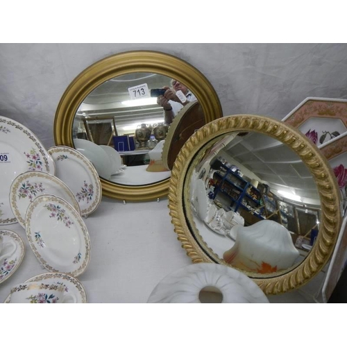 713 - Two small oval gilt framed mirrors, COLLECT ONLY.