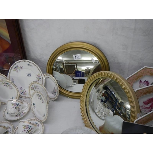 713 - Two small oval gilt framed mirrors, COLLECT ONLY.