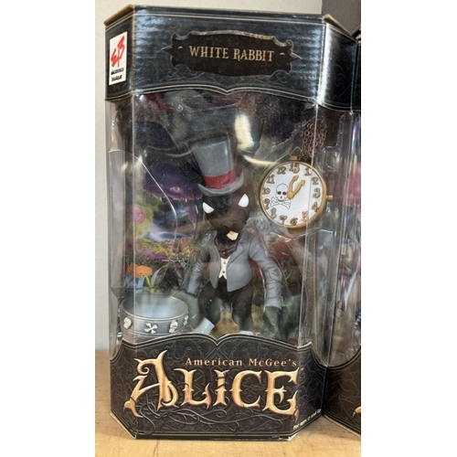 15 - 4 boxed American McGee's Alice in Wonderland figures, including white rabbits, and Alice, as new