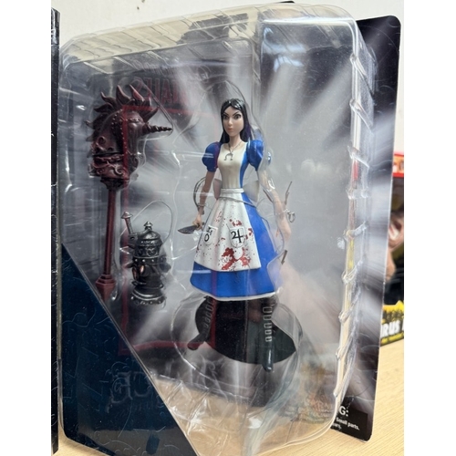 17 - 3 boxed Alice in Wonderland Alice figures, Femme Fatales, Madness returns as new