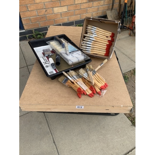 613 - A paste table, paintbrushes & rollers