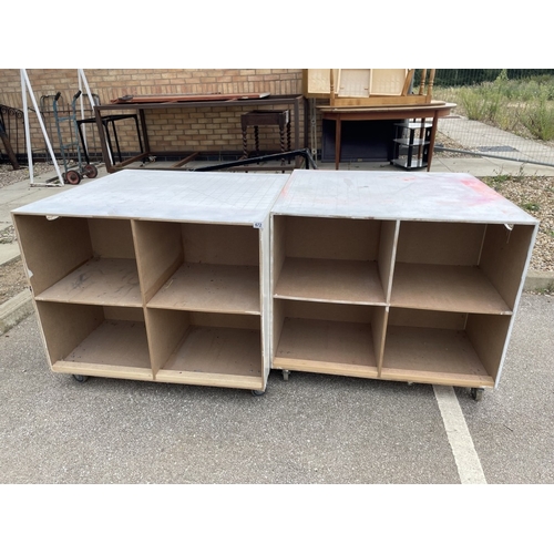 672 - Two large wooden storage units on wheels