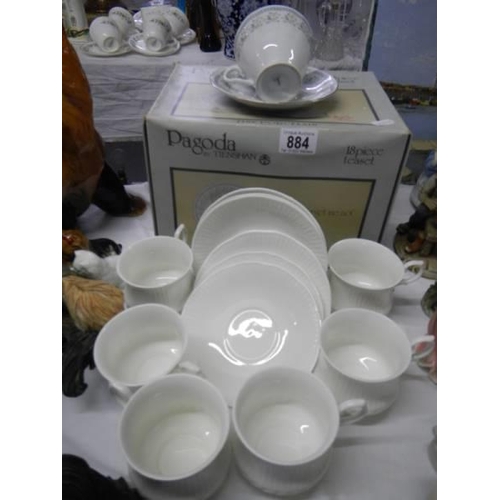 884 - A boxed 18 piece tea set.