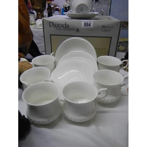 884 - A boxed 18 piece tea set.