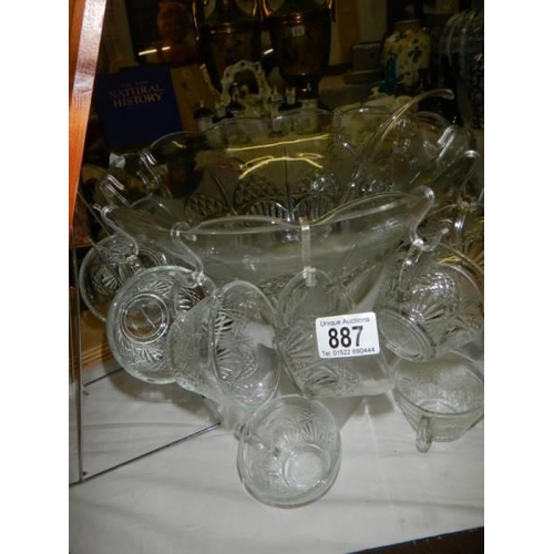 887 - A large glass punch bowl with cups and a plastic ladle. COLLECT ONLY.