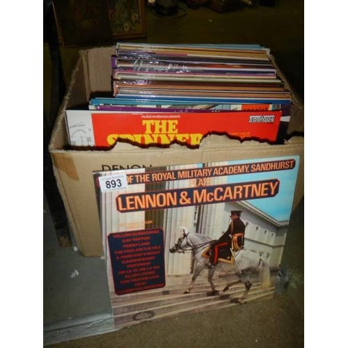 893 - A box of LP records.