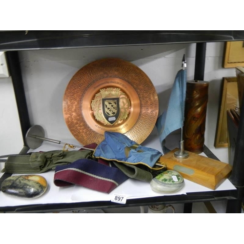 897 - A miscellaneous lot including embossed copper lamp base, wall plaque, flags etc.,