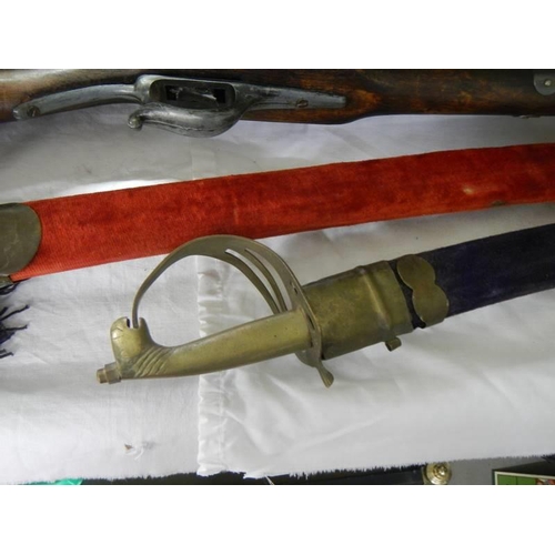 907 - An old rifle wall piece (a/f) and two Japanese style swords, COLLECT ONLY.