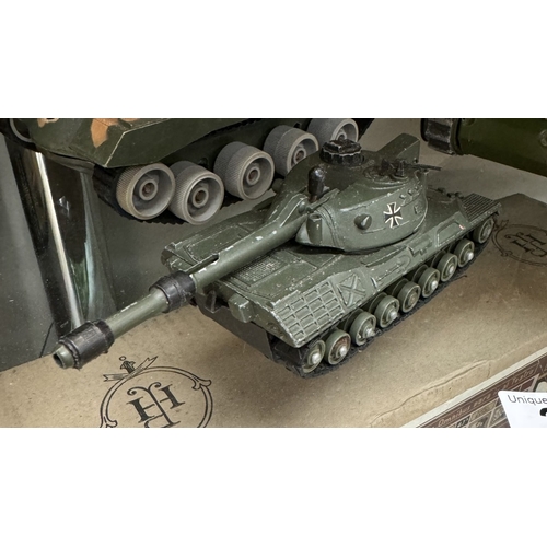 28 - A Marx Battery Up tank, one other, A Dinky Leopard tank & Britains scout car