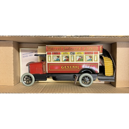 30 - A boxed international express locomotive, Paya clockwork tinplate bus & A large Mettoy tin lithograp... 