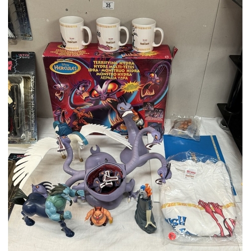 35 - A boxed Disney Hercules Terrifying Hydra, A quantity of loose figures, Three new mugs & A new T-Shir... 