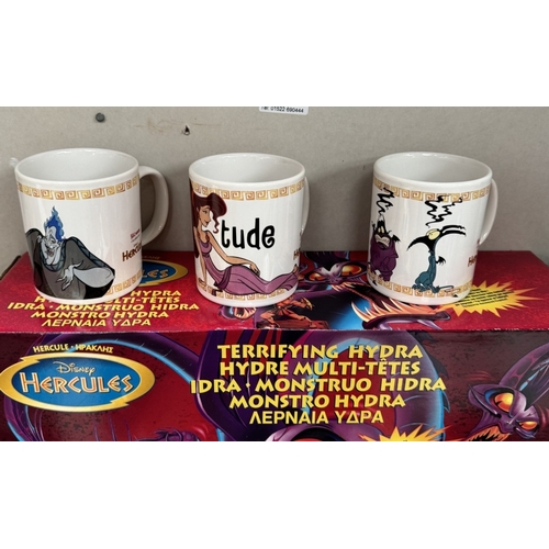 35 - A boxed Disney Hercules Terrifying Hydra, A quantity of loose figures, Three new mugs & A new T-Shir... 