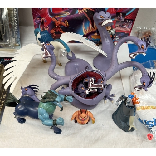 35 - A boxed Disney Hercules Terrifying Hydra, A quantity of loose figures, Three new mugs & A new T-Shir... 