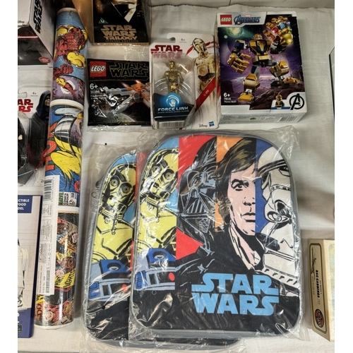 47 - A collection of new Star Wars items including figures, mugs in a box, backpacks & Avengers items