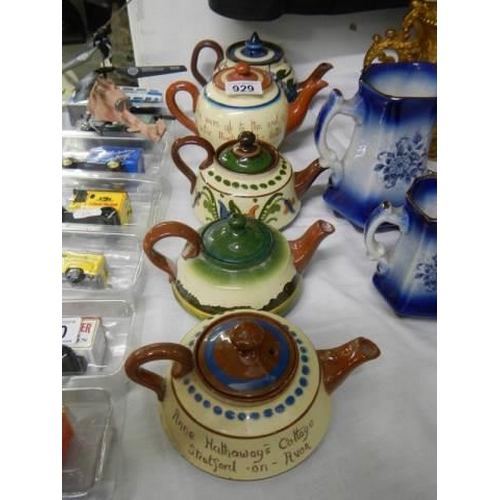 929 - Five good Torquay motto ware souvenir teapots.