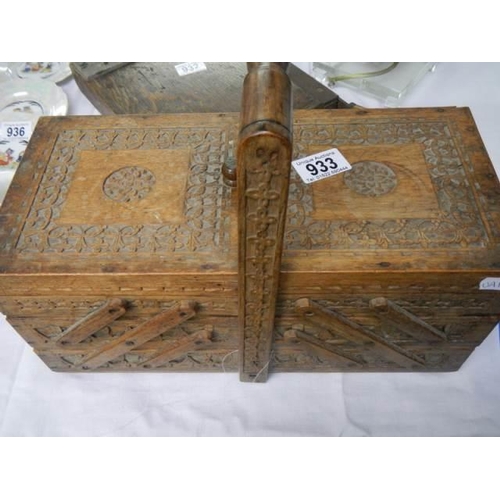 933 - A good carved concertina sewing box.