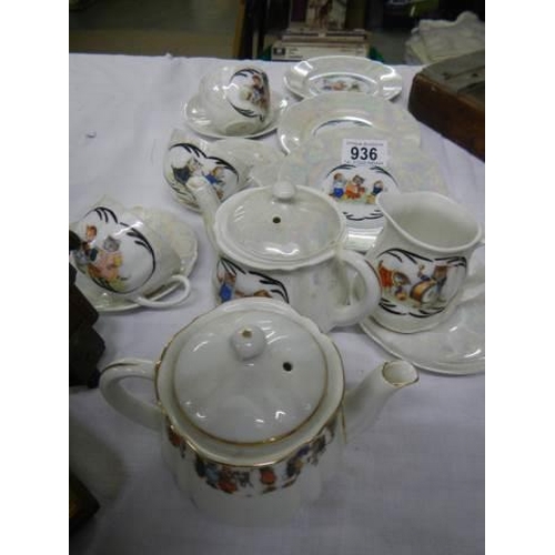 936 - A part tea set decorated with Louis Wain style cats.