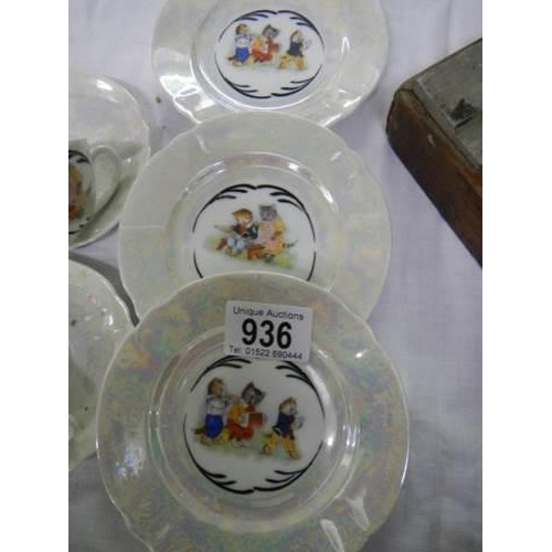 936 - A part tea set decorated with Louis Wain style cats.