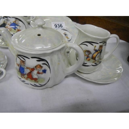 936 - A part tea set decorated with Louis Wain style cats.