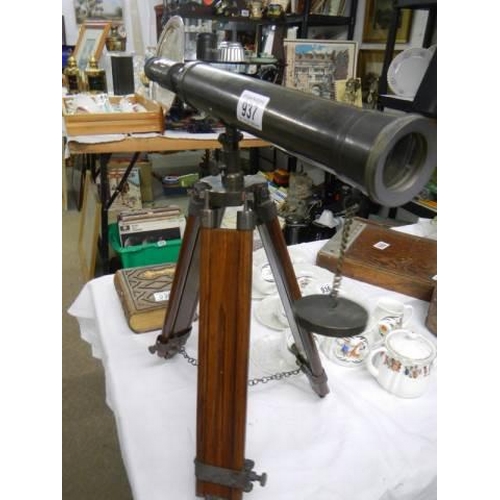 937 - A brass adjustable telescope on tripod.