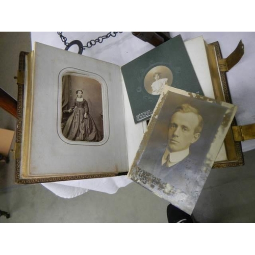 938 - A good Victorian photo album with brass fittings.