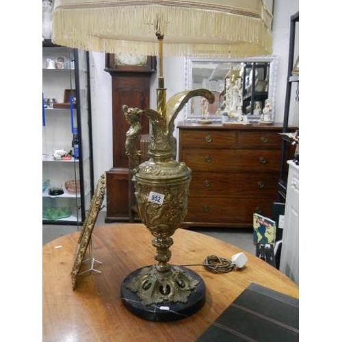 952 - A tall gilt urn shaped lamp on a marble base, COLLECT ONLY.