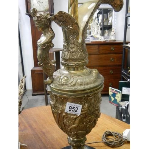 952 - A tall gilt urn shaped lamp on a marble base, COLLECT ONLY.