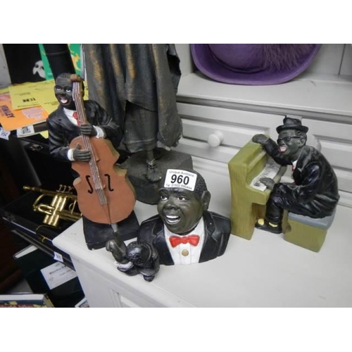 960 - A set of three black musician figures and another figure. COLLECT ONLY.