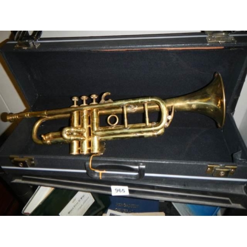 965 - A cased trumpet.