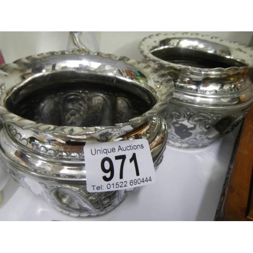 971 - A pair of small silver plate plant pots and a small box.