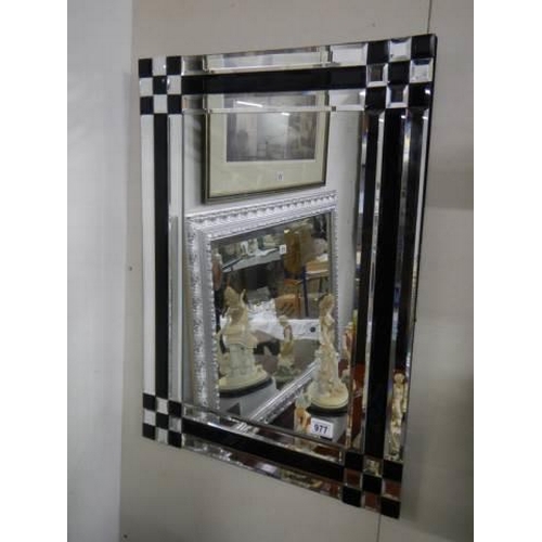 977 - A modern black and clear bevelled mirror, COLLECT ONLY.